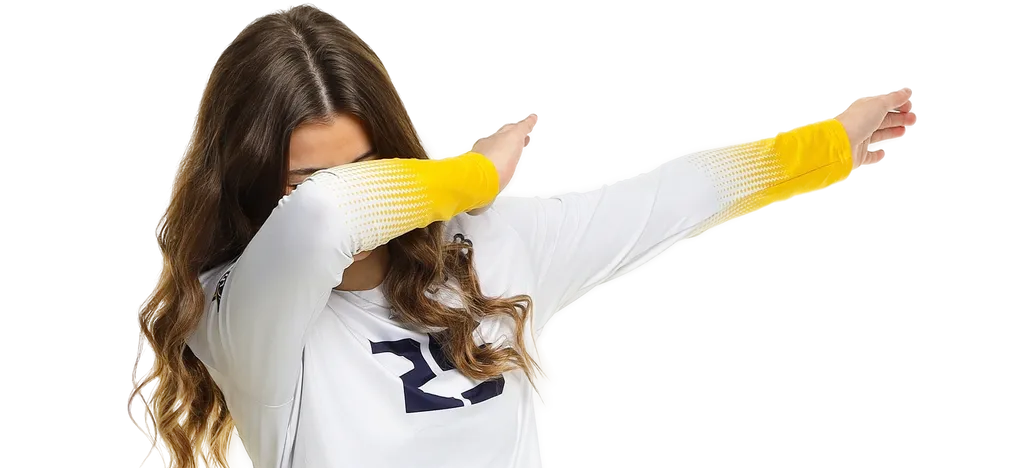 A woman performing a dab dance move wearing a white sweater with yellow sleeves.